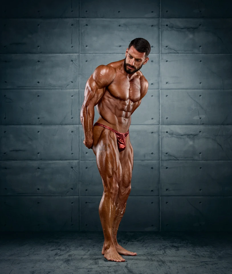 IFBB athlete posing in studio
